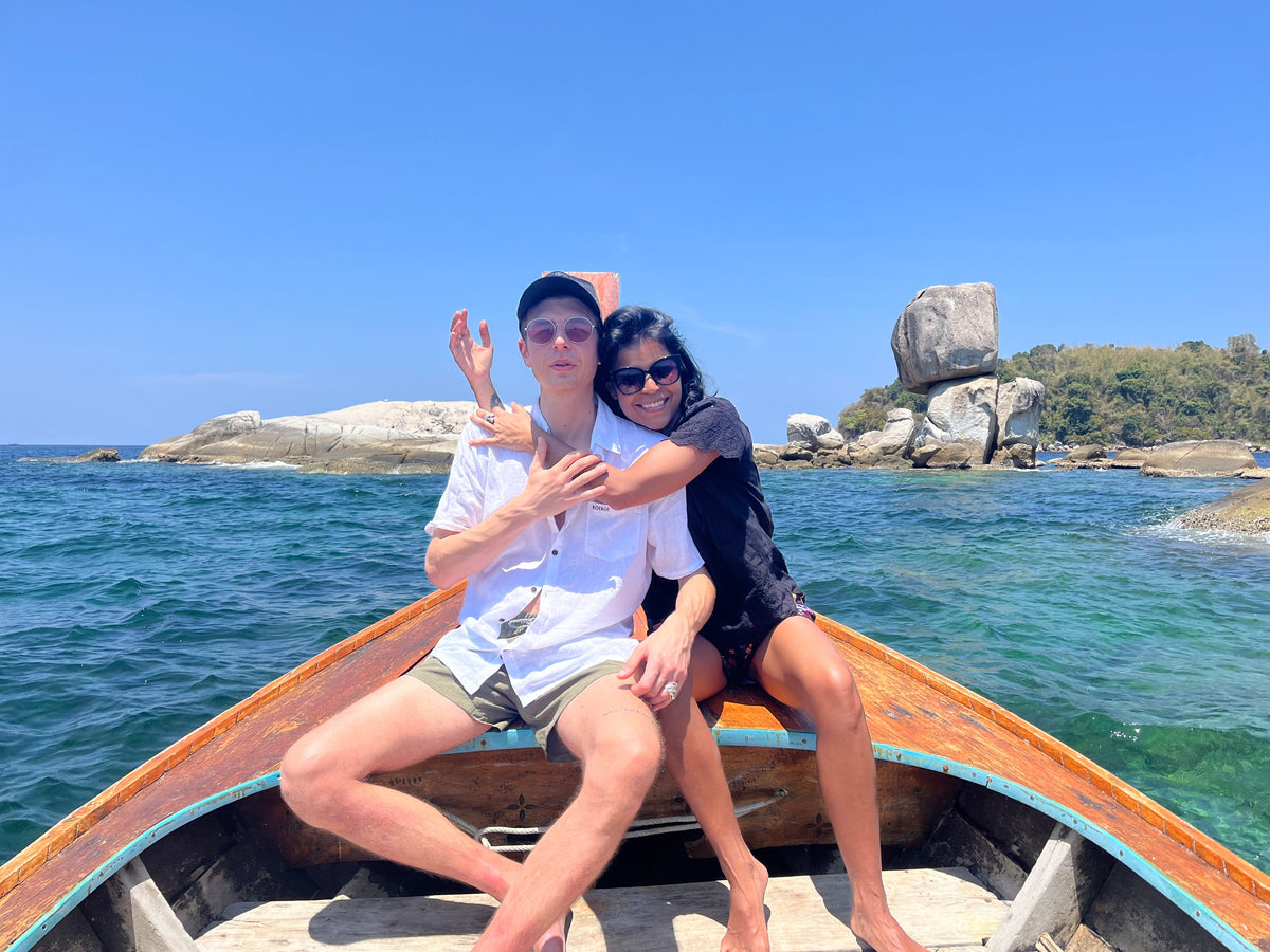 A couple on a boat hugging